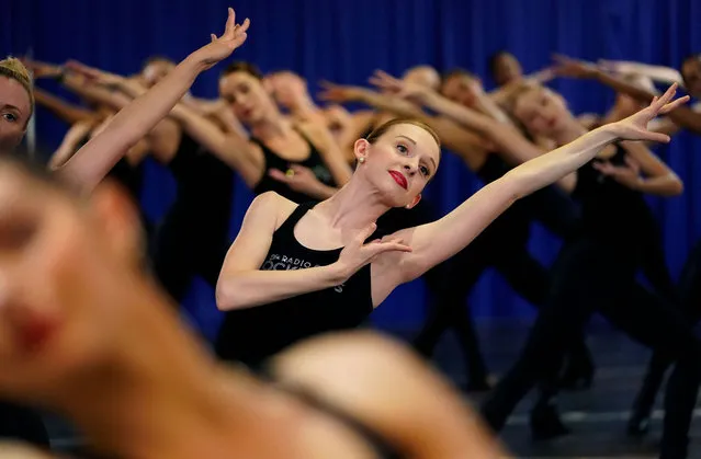 The Radio City Rockettes perform during a rehearsal for their Christmas show in New York City, on October 13, 2021. The 2021 production will run from November 5, 2021, to January 2, 2022, at Radio City Music Hall. (Photo by Timothy A. Clary/AFP Photo)