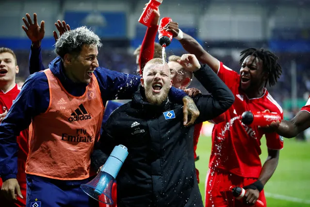 Hamburg SV's Leo Lacroix, Rick Van Drongelen and Gideon Jung celebrate after the DFB Pokal quarter final match between SC Paderborn 07 and Hamburger SV at Benteler Arena on April 02, 2019 in Paderborn, Germany. (Photo by Wolfgang Rattay/Reuters)