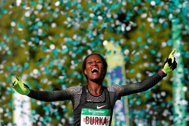 Ethiopia's Gelete Burka celebrates her victory as she crosses the finish line of Paris Marathon on April 14, 2019. (Photo by Regis Duvignau/Reuters)