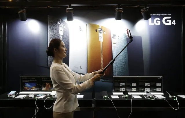 A model takes a selfie with an LG Electronics' new G4 smartphone during its unveiling ceremony in Seoul, South Korea Wednesday, April 29, 2015. (Photo by Ahn Young-joon/AP Photo)