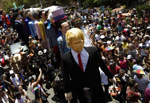 In this Monday, February 27, 2017 photo, a giant puppet depicting U.S. President Donald Trump is paraded at Carnival celebrations in Olinda, Pernambuco state, Brazil. (Photo by Diego Herculano/AP Photo)