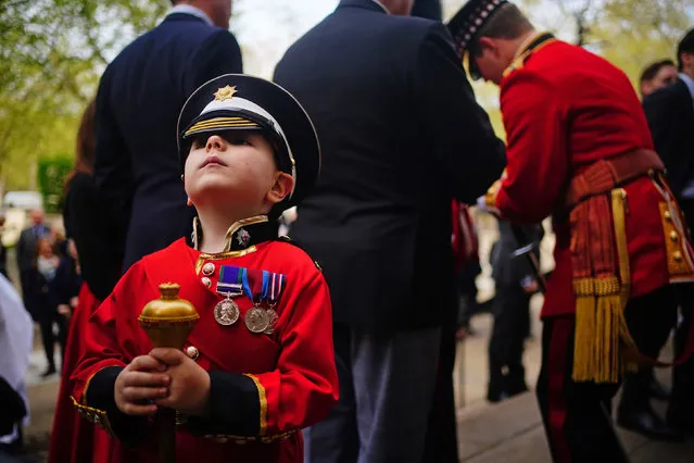 A young boy in replica uniform joins members of the Scots Guards as they gather ahead of the Black Sunday Parade, at the chapel of the Guards Museum in Wellington Barracks, Westminster, London on Sunday, April 14, 2024. (Photo by Victoria Jones/PA Images via Getty Images)