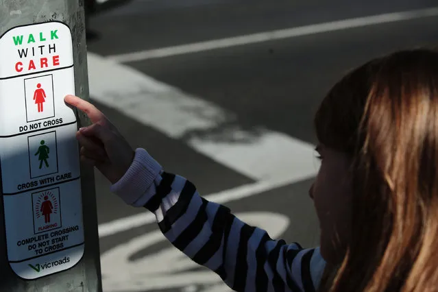 Female traffic light signals are installed at the intersection of Swanston and Flinders streets on March 7, 2017 in Melbourne, Australia. Ten female pedestrian crossing signals are being installed as part of a 12-month trial in an aim to address unconscious gender bias. The Committee for Melbourne, a non-profit organisation comprising more than 120 Melbourne business and community groups, is behind the move. (Photo by Stefan Postles/Getty Images)