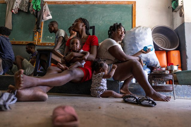 People displaced by gang war violence take refuge at the Antenor Firmin high school transformed into a shelter, living there in poor conditions, in Port-au-Prince, Haiti on May 1, 2024. (Photo by Ricardo Arduengo/Reuters)