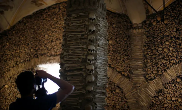 A tourist takes pictures at the Bones chapel in Evora, Portugal April 5, 2017. (Photo by Rafael Marchante/Reuters)