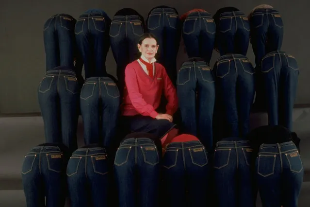 Portrait of socialite/designer Gloria Vanderbilt sitting amidst a group of models bending over to accent the rear of her designer jeans, 1978. (Photo by Evelyn Floret/The LIFE Images Collection via Getty Images/Getty Images)