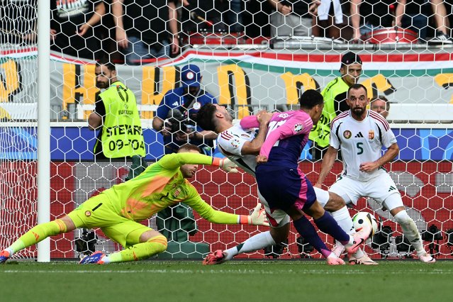 Germany's midfielder #10 Jamal Musiala shoots to score his team's first goal during the UEFA Euro 2024 Group A football match between Germany and Hungary at the Stuttgart Arena in Stuttgart on June 19, 2024. (Photo by Thomas Kienzle/AFP Photo)