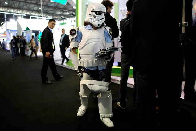 A staff wearing the costume of First Order Stormtrooper Battle Buddy from the film “Star Wars” is seen at CES (Consumer Electronics Show) Asia 2016 in Shanghai, China, May 12, 2016. (Photo by Aly Song/Reuters)