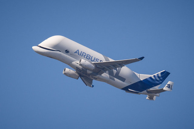 An Airbus A300-600ST “Beluga” cargo aircraft flies over the southern city of Toulouse after taking off on March 13, 2024. (Photo by Ed Jones/AFP Photo)