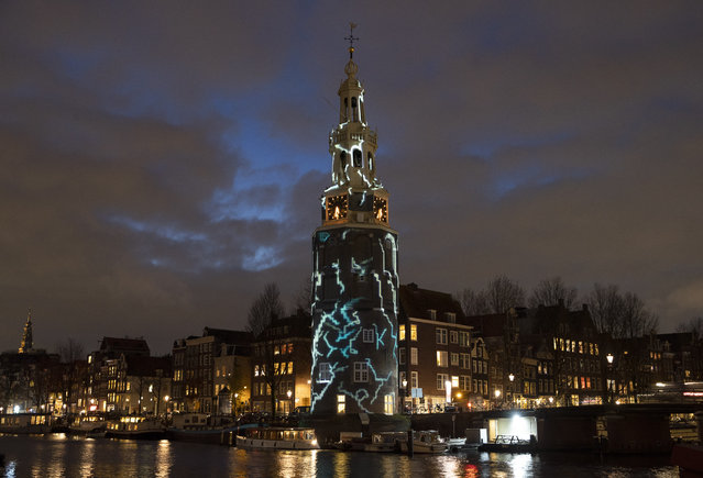 A light art work titled “The Cracks” by Karolina Howorko is seen during the Amsterdam Light Festival in Amsterdam, Netherlands, Wednesday, November 27, 2019. The theme of the open air exhibition is “DISRUPT!”, and the art works are exhibited from 28 Nov. to 19 Jan. 2020. (Photo by Peter Dejong/AP Photo)