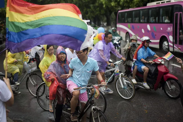 Supporters of LGBT community ride bicycles during the fourth gay pride parade on August 2, 2015 in Hanoi, Vietnam. Hundreds of demonstrators march through the streets of the Vietnamese capital urging an end to discrimination against the lesbian, gay, bisexual and transgender (LGBT) community as homosexuality remains a taboo in Vietnam. (Photo by Borja Sanchez-Trillo/Getty Images)