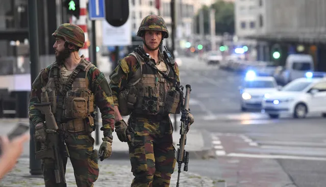 Belgian Army soldiers patrol outside Central Station after a reported explosion in Brussels on Tuesday, June 20, 2017. Belgian media are reporting that explosion-like noises have been heard at a Brussels train station, prompting the evacuation of a main square. (Photo by Geert Vanden Wijngaert/AP Photo)