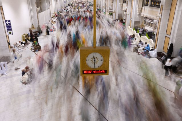 Muslim pilgrims commute at the Grand Mosque in the holy city of Mecca on June 30, 2023 during the annual Hajj pilgrimage. (Photo by AFP Photo/Stringer)