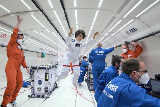 A Barbie doll version of an Italian astronaut Samantha Cristoforetti is seen during a zero-gravity flight with members of the European Space Agency in an unknown location on October 4, 2021. (Photo by Courtesy of ESA/Simone Marocchi/Handout via Reuters)