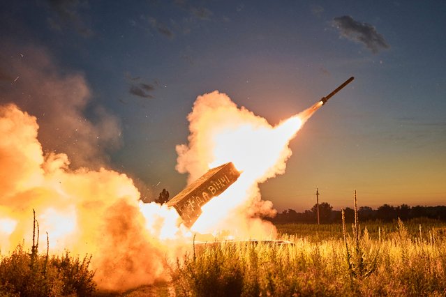 Ukrainian forces fire a TOS-1A “Solntsepyok” heavy thermobaric rocket launcher toward Russian positions near Kreminna, in the Luhansk region, on July 7, 2023. The Ukrainian Army's Da Vinci Battalion captured the weapon. (Photo by Linkos/AP Photo)