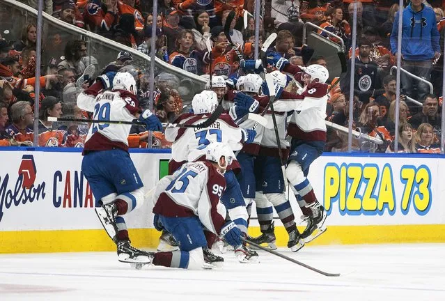 The Colorado Avalanche celebrate the win over the Edmonton Oilers during overtime in NHL hockey conference finals action in Edmonton, Alberta, Monday, June 6, 2022. (Photo by Jason Franson/The Canadian Press via AP Photo)