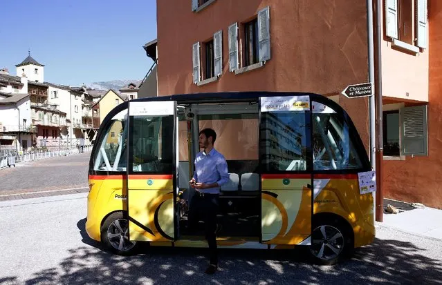 The first autonomous and electric shuttle of PostAuto Schweiz stands in the old village of Sion, Switzerland June 23, 2016. (Photo by Ruben Sprich/Reuters)