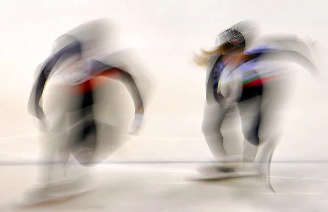 In this picture taken with a long time exposure athletes start during the mixed 2000 m relay during the World Cup short track speed skating championship in Dresden, eastern Germany, Friday, February 7, 2020. The ISU World Cup runs from Feb. 7 to Feb. 9. 2020. (Photo by Jens Meyer/AP Photo)