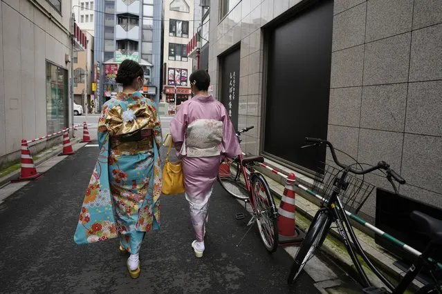 A Japanese woman and her daughter leave Daikichi kimono rental shop Wednesday, June 22, 2022, in Tokyo's Asakusa area famous for sightseeing, before attending their family friend's wedding. Japan is bracing for a return of tourists from abroad, as border controls to curb the spread of coronavirus infections are gradually loosened. Yusuke Otomo, who owns the kimono rental shop, can barely contain his excitement. (Photo by Hiro Komae/AP Photo)