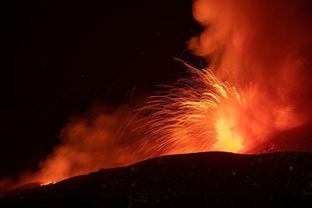 Lava flows from the Mount Etna volcano on the southern Italian island of Sicily near Catania on August 15, 2014. (Photo by Marco Restivo/Etna Walk via Reuters)