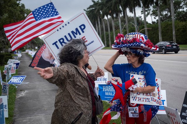 Supporters of Donald Trump gather outside a polling station on Election Day in West Palm Beach, Florida on November 5, 2024. (Photo by Marco Bello/Reuters)