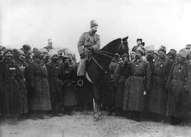Tsar Nicholas II (1868–1918) in Cossack uniform inspecting Cossacks, 1917.