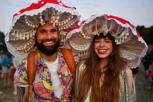 A couplein fancy dress pose for a photograph during day one of Glastonbury Festival at Worthy Farm, Pilton on June 22, 2022 in Glastonbury, England. (Photo by Dave J. Hogan/Getty Images)