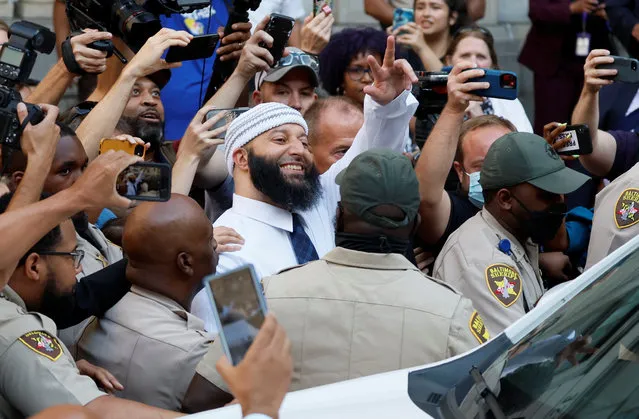 Adnan Syed, whose case was chronicled in the hit podcast ?Serial,? waves as he exits the courthouse after a judge overturned Syed's 2000 murder conviction and ordered a new trial during a hearing at the Baltimore City Circuit Courthouse in Baltimore, Maryland U.S., September 19, 2022. (Photo by Evelyn Hockstein/Reuters)