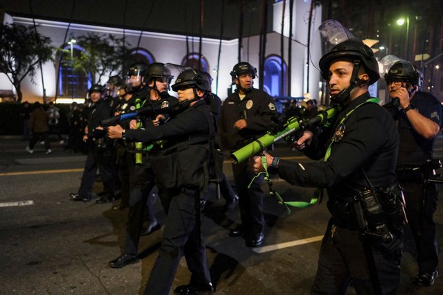 LAPD officers shoot non-lethal munitions during a protest against arrests and deportations of migrants by U.S. government agencies in Los Angeles, California, U.S. February 2, 2025. (Photo by Joel Angel Juarez/Reuters)