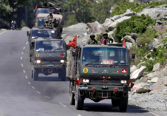 An Indian Army convoy moves along a highway leading to Ladakh, at Gagangeer in Kashmir's Ganderbal district June 18, 2020. (Photo by Danish Ismail/Reuters)