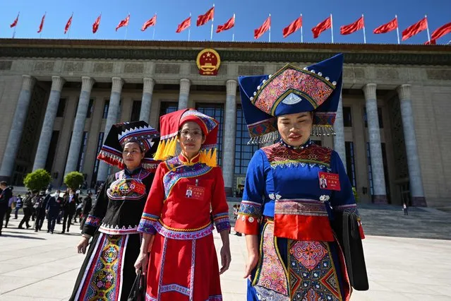 Delegates are seen after the opening session of the 20th Chinese Communist Party's Congress at the Great Hall of the People in Beijing on October 16, 2022. (Photo by Noel Celis/AFP Photo)