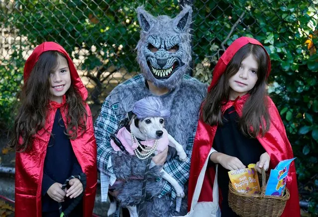 Dogs and owners compete in the 32nd Tompkins Square Halloween Dog Parade on October 22, 2022, at Tompkins Square in New York City. (Photo by Timothy A. Clary/AFP Photo)