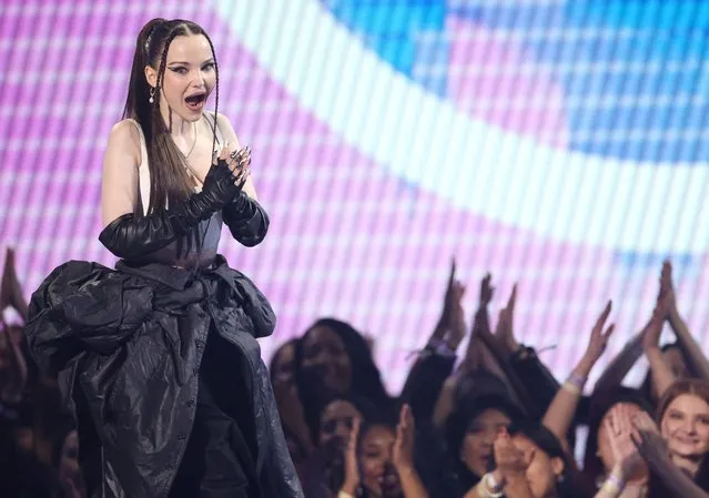 American singer and actress Dove Cameron reacts as she receives the New Artist of the Year award during 2022 American Music Awards, at the Microsoft Theater in Los Angeles, California, U.S., November 20, 2022. (Photo by Mario Anzuoni/Reuters)