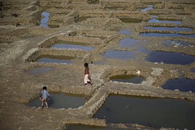 Rohingya refugee children play outside the Shamlapur refugee camp near Cox's Bazar, Bangladesh December 20, 2017. (Photo by Marko Djurica/Reuters)