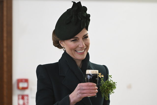 Britain's Kate, the Princess of Wales, gestures during a reception with the Irish Guards, at a special St Patrick's Day parade and celebration at Wellington Barracks in London, Monday, March 17, 2025. (Photo by Eddie Mulholland/Pool photo via AP Photo)