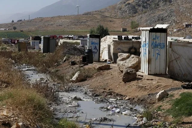 Toilets donated by Unicef and World Vision stand near tents at a Syrian refugee settlement camp in Qab Elias in the Bekaa Valley, near Baalbek, Lebanon October 17, 2015. (Photo by Jamal Saidi/Reuters)