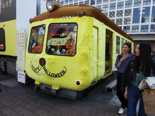 Aogaeru (green frog), an iconic train car that sits in front of JR Shibuya Station in Tokyo, Japan near the famous Hachiko statue, is seen Thursday, October 20, 2016 dressed up to look like Sanrio's popular character Pom Pom Purin in an effort to prevent vandalism on Halloween night. (Photo by Daisuke Kikuchi/Kyodo News)