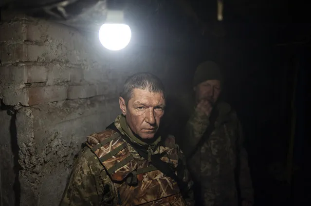 Ukrainian soldiers in a shelter in war-hit Bakhmut, Donetsk region, Ukraine, Wednesday, April 12, 2023. (Photo by Iryna Rubakova via AP Photo)