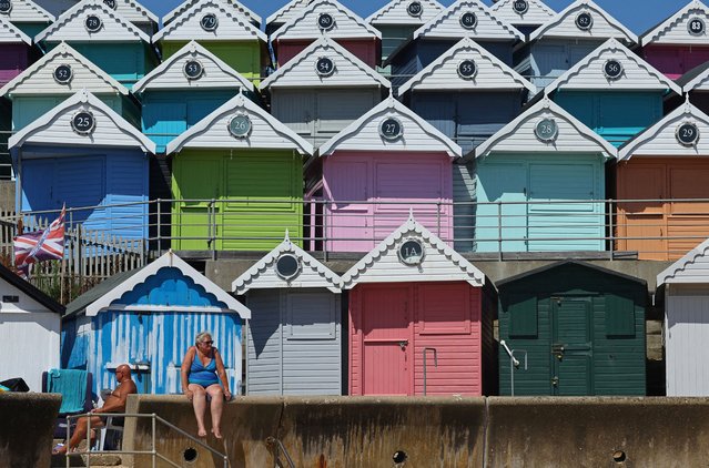 People relax during hot weather at the beach at Walton-on-the-Naze, southern Britain on August 13, 2024. (Photo by Toby Melville/Reuters)