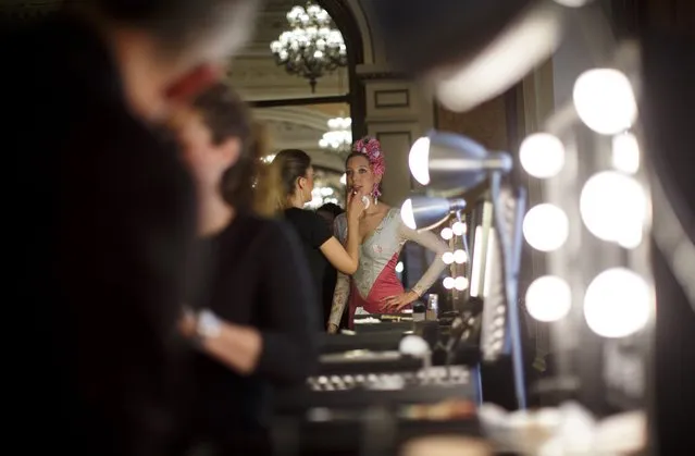 A model has make up applied backstage during the “We Love Flamenco” fashion show in the Andalusian capital of Seville January 14, 2015. (Photo by Marcelo del Pozo/Reuters)