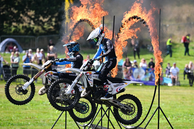 Solent Stars Youth Motorbike Stunt Team perform for the crowds after high winds prevented flying in the planned mass sun rise ascent at the Bristol International Balloon Fiesta at the Ashton Court estate, on August 09, 2024 in Bristol, England. Now in its 46th year, the Bristol International Balloon Fiesta is Europe's largest annual hot-air balloon event in a city that is seen by many balloonists as the home of modern ballooning. (Photo by Finnbarr Webster/Getty Images)