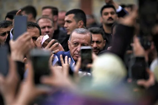 Turkish President and leader of the People Alliance party, presidential candidate Recep Tayyip Erdogan, leaves after he casted his ballot at a polling station in Istanbul, Turkey, Sunday, May 28, 2023. Erdogan, who has been at Turkey's helm for 20 years, is favored to win a new five-year term in the second-round runoff after coming just short of an outright victory in the first round on May 14. (Photo by Emrah Gurel/AP Photo)