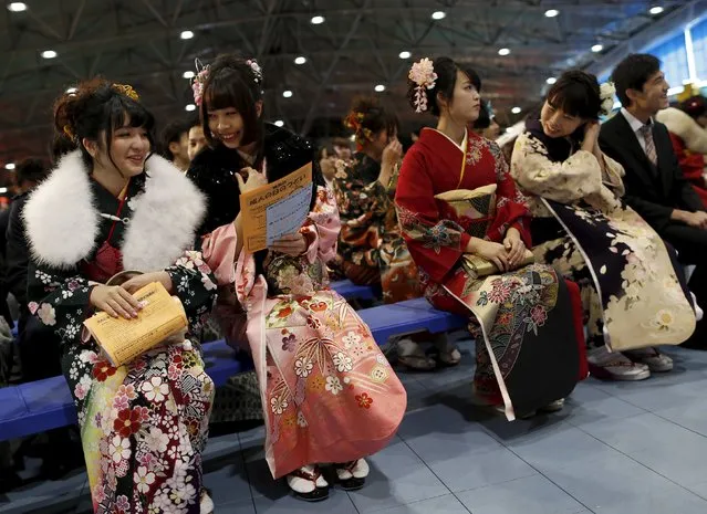 Japanese women wearing kimonos attend a Coming of Age Day celebration ceremony at an amusement park in Tokyo January 11, 2016. (Photo by Yuya Shino/Reuters)
