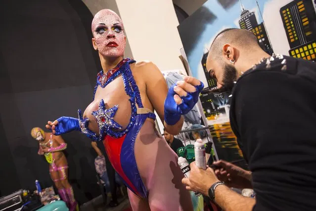 A participant gets ready backstage before a drag queen competition during carnival festivities in Las Palmas on the Spanish Canary Island of Gran Canaria February 20, 2015. (Photo by Borja Suarez/Reuters)