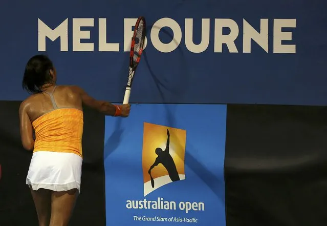 Britain's Heather Watson smashes her racquet into the signage during her first round match against Hungary's Timea Babos at the Australian Open tennis tournament at Melbourne Park, Australia, January 18, 2016. (Photo by Jason O'Brien/Reuters)