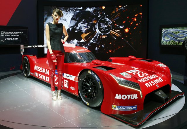 A model poses next to the new Nissan GT-R NISMO race car during the second press day ahead of the 85th International Motor Show in Geneva March 4, 2015. REUTERS/Arnd Wiegmann   