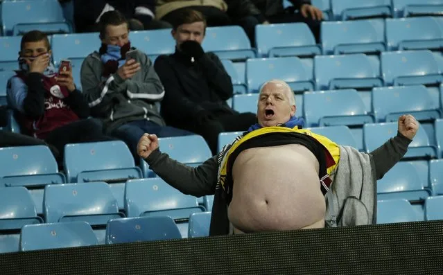Football, Aston Villa vs Manchester City, FA Cup Fourth Round, Villa Park on January 30, 2016: Aston Villa fan lifts his shirt in the stands. (Photo by Andrew Boyers/Reuters/Action Images)