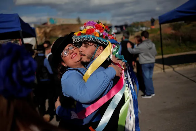 People in traditional costumes embrace each other before competing in the 55th Verdiales music contest in Malaga, southern Spain December 28, 2016. (Photo by Jon Nazca/Reuters)