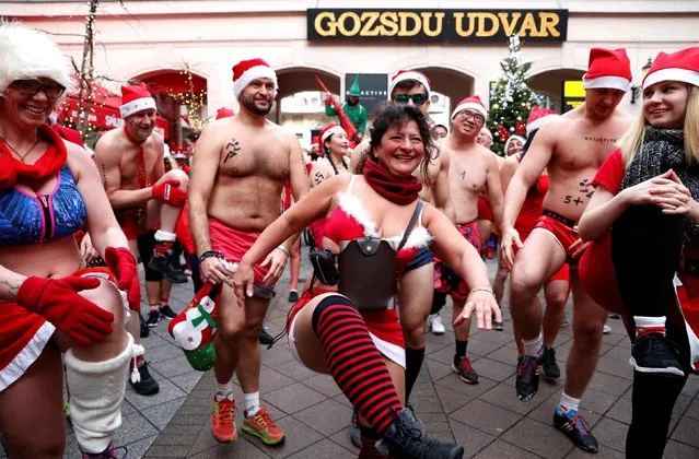 People take part in a half naked Santa run in downtown Budapest, Hungary, December 9, 2018. (Photo by Bernadett Szabo/Reuters)