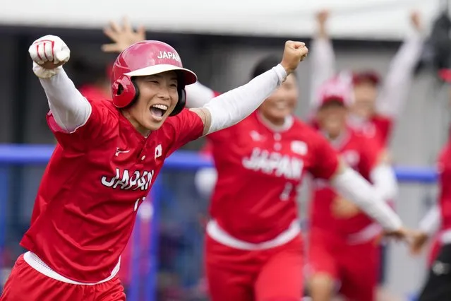 Japan's Eri Yamada celebrates their win over Mexico during their softball game at the 2020 Summer Olympics, Thursday, July 22, 2021, in Fukushima, Japan. (Photo by Jae C. Hong/AP Photo)